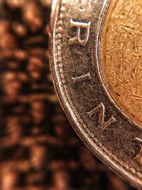 Close-up of coins on metal