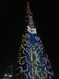 Low angle view of modern building at night