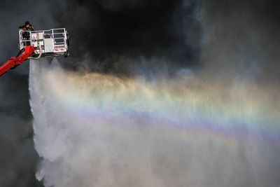 Firefighter extinguishing fire