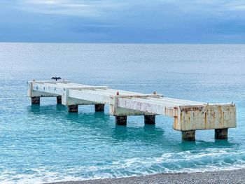 View of pier on sea against sky
