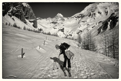 People skiing on snowcapped mountain