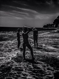 People on beach at sunset