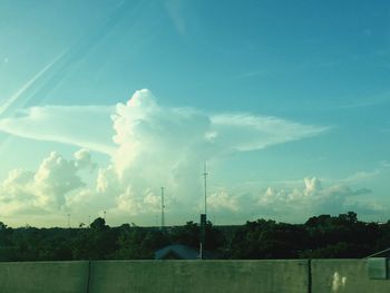 Power lines against blue sky