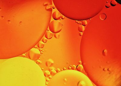 Full frame shot of water drops on orange