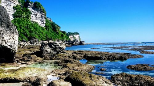 Scenic view of sea against clear blue sky