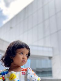 Portrait of cute girl looking away