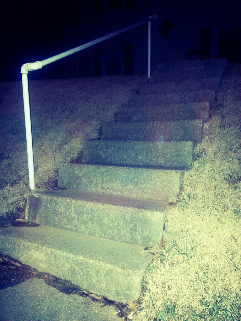 night, empty, shadow, steps, built structure, sunlight, street, architecture, high angle view, wall - building feature, no people, absence, footpath, sidewalk, outdoors, abandoned, bench, paving stone, grass