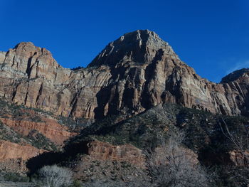 Scenic view of rocky mountains against clear sky