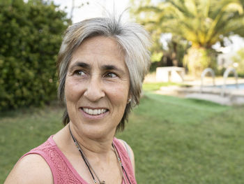 Woman with senior white hair, pretty girl smiling, nature background person