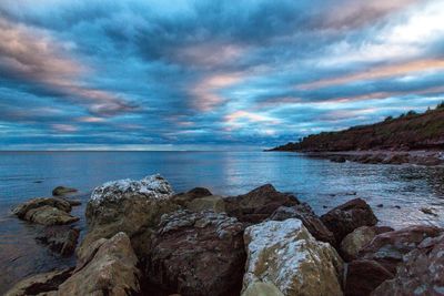 Scenic view of sea against blue sky