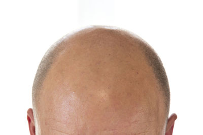 Close-up of woman against white background