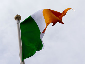 Low angle view of angel irish flag against sky