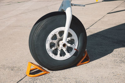 Cropped airplane parked on runway