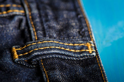 Close-up of jeans on table