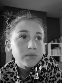 Close-up portrait of girl at home