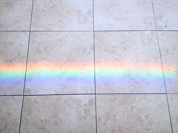 Close-up of rainbow on tiled floor