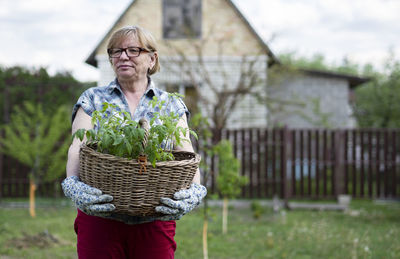 Portrait of man wearing basket outdoors