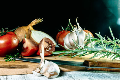 Close-up of vegetables on table against black background
