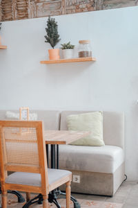 Full portrait of empty chairs and tables on the wall at home