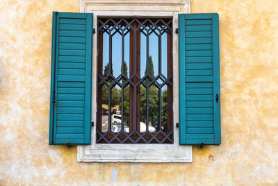 Windows in the facades of ancient venetian houses