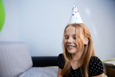 Children have fun playing, blowing up colorful balloons, at a birthday party