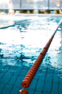 Close-up of rope tied to swimming pool