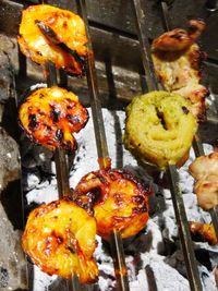 High angle view of meat on barbecue grill