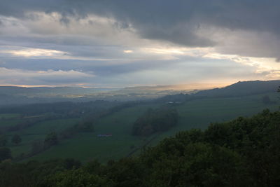 Scenic view of landscape against sky during sunset