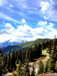 Scenic view of mountains against cloudy sky