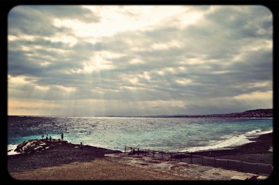 Scenic view of sea against cloudy sky