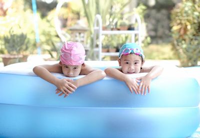 Portrait of cute girl in swimming pool
