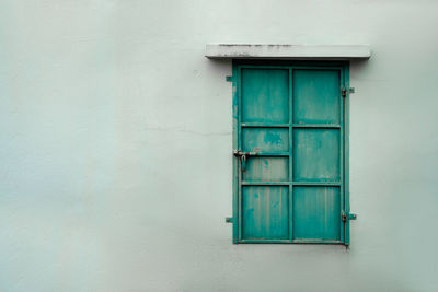 Closed blue door of building