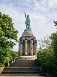 Low angle view of statue against sky