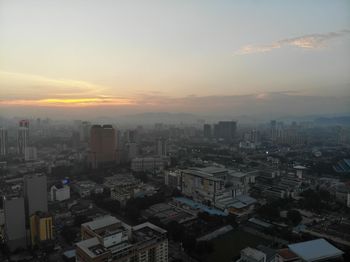 High angle view of buildings against sky during sunset