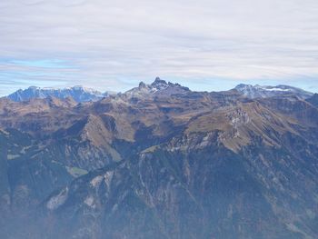 View of mountain range against cloudy sky