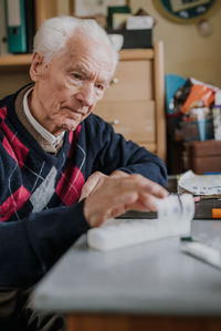 Portrait of man working on table