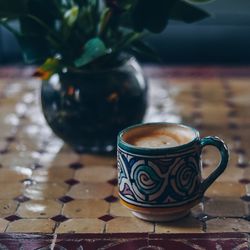 Close-up of coffee cup on table