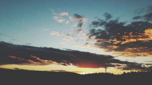 Scenic view of silhouette landscape against sky during sunset