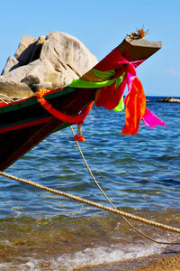 Close-up of multi colored umbrella on beach