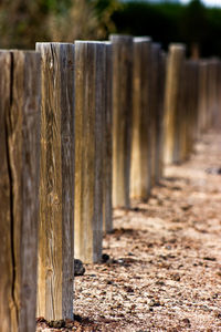 Close-up of wooden fence on field