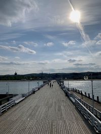 View of pier over river against sky