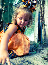 Baby girl playing on field