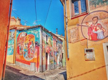 Graffiti on wall of building against sky