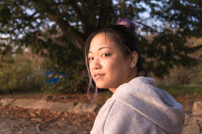 Asian woman looking at camera