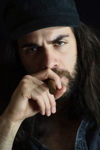 Close-up portrait of man wearing hat