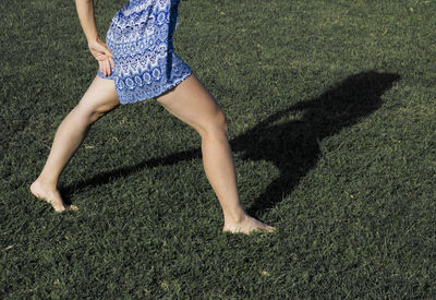 Low section of woman on grassland