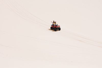 High angle view of family on quadbike at desert