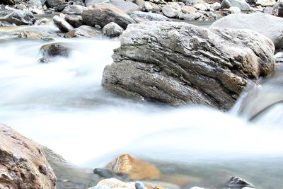 Scenic view of waterfall against sky