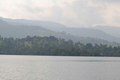 Scenic view of landscape and mountains against sky