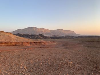 Scenic view of desert against clear sky